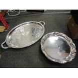 An oval plated twin handled tray and a wavy rim plated tray on cabriole feet