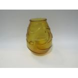 A circa 1960 amber frosted glass vase, three raised fish design,