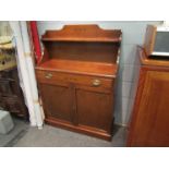 A Regency style mahogany chiffonier with raised shelf back and holly inlaid decoration the single