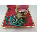 A jewellery box with bijouterie contents including necklaces, earrings,
