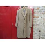 A gent's two piece check suit and a camel wool overcoat
