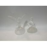 A glass owl figure and glass horse figure