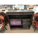 A Victorian carved oak bookshelf with adjustable height shelves,