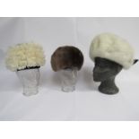 An Edna Wallace beige moleskin fur hat,