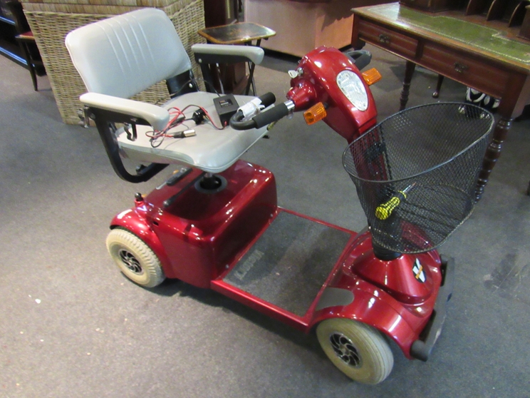 A Victory mobility scooter with charging lead