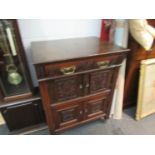 A 20th Century miniature oak low single drawer over two door cabinet with beaded decoration,