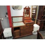 In the manner of "Maple & Co" a late Victorian walnut combination washstand dressing chest,