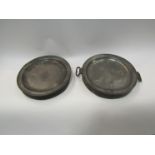 A pair of pewter food warmers