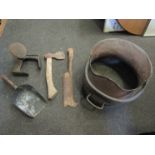 A coal scuttle, flat irons, stones and tools,