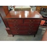 A late George III mahogany chest of two short over three graduating long drawers with brass swan