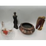 A rustic copper dish, African figure and two other figures,