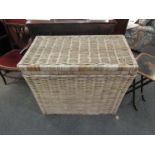 A lidded wicker basket,