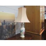 A decorative table lamp with shade