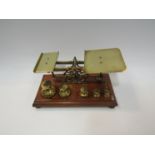 A set of brass letter scales with weights