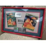 A framed Disney Lion King multi-platinum sales award,