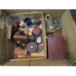A box containing miniature assorted items including blue glass liners, trophy stands,