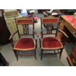 A pair of Edwardian inlaid mahogany elbow chairs