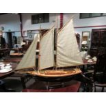 A wooden model schooner, approx.