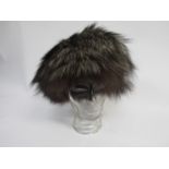 A brown fox fur hat