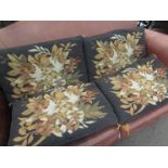 Four brown woven tapestry style rectangular cushions with tasseled corners,