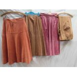Two 1970's suede skirts in coral and camel, a Modele edition "Maggy Rouff Paris" label,