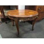 A French style parquetry circular top occasional table on carved cabriole legs,
