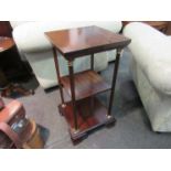 A Georgian style mahogany three tier lamp table the brass corinthian top mahogany supports over