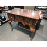 A 20th Century Queen Anne style low boy with three drawers on cabriole legs,