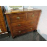 Circa 1860 chest of two short over two long drawers with turned bun handles and feet,