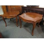 A pair of French style serpentine top lamp tables on carved cabriole legs,
