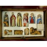 A porcelain nativity set and rocking horse Christmas decorations