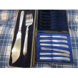 A white metal fish knife and fork set, cased a/f and a set of six butter knives,