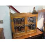 An Old Charm oak astragal glazed two door wall mounted cabinet