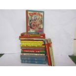A box of mixed books and annuals including 'The Holiday Book',