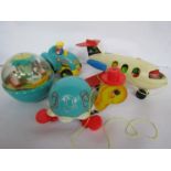 A box containing Fisher Price toys including Fun Jet and Roly Poly Chime ball