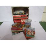 A box of books and annuals including Ladybird series