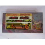 A boxed Matchbox Superfast Champions G-2 Big Mover set containing diecast car transporter and five