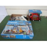 A boxed Sylvanian Families Country Bus and a Playmobil City Action set