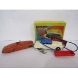 A boxed Marx Battery Operated Electric Car and a Fire Chief car with friction motor