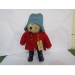 A 1970's Gabrielle soft filled Paddington Bear in red duffle coat, blue wellingtons and hat,