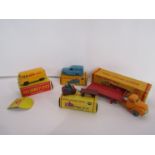 Four boxed Dinky Dublo diecast vehicles including 072 Bedford Articulated Flat Truck,