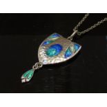 An Art Nouveau silver and enamel pendant necklace by James Fenton 1908, hammered silver front, 4.