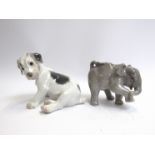 A Royal Copenhagen figure of a seated dog and one of an elephant,