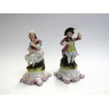 Two early 20th Century porcelain seated figures,