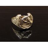 A 9ct gold equestrian ring designed with horses head in horse shoe. Size V, 4.