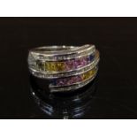 A 9ct white gold multi-coloured sapphire and diamond ring. Size R, 6.