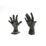 Two cast bronze sculptured hands,