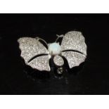 An opal and crystal butterfly brooch stamped 925, 4.7cm wide, 12.