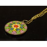 A Millefiori circular pendant on 15ct gold necklace, 42cm long, 8.