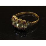 A Victorian 15ct gold ring set with rubies and citrine. Size P/Q, 1.